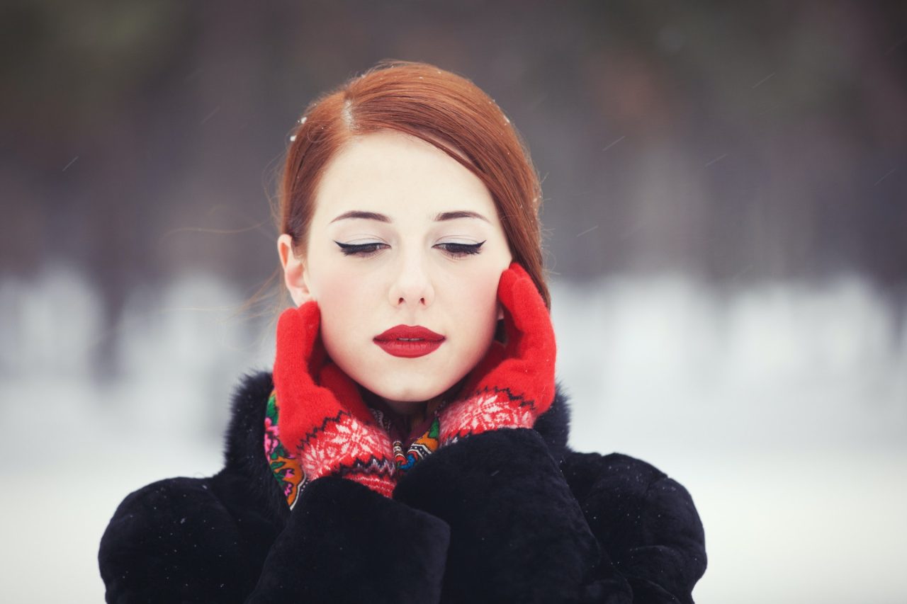 Beautiful redhead women with in winter park.